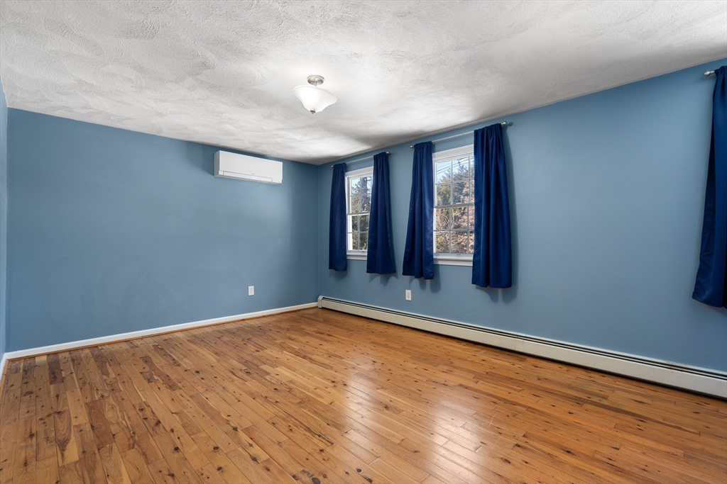 370 Peakham Road Sudbury, MA 01776 - Photo 31 of 41 wooden floor in an empty room with a window