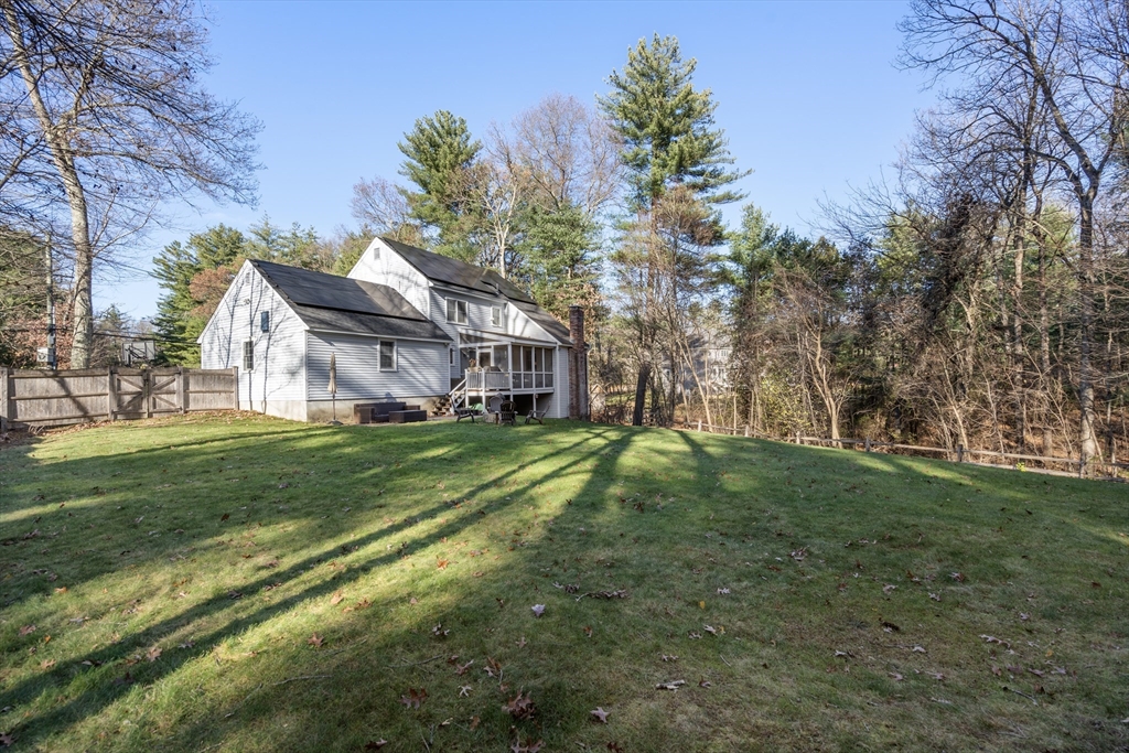 370 Peakham Road Sudbury, MA 01776 - Photo 4 of 41 a view of a big house with a big yard and large trees