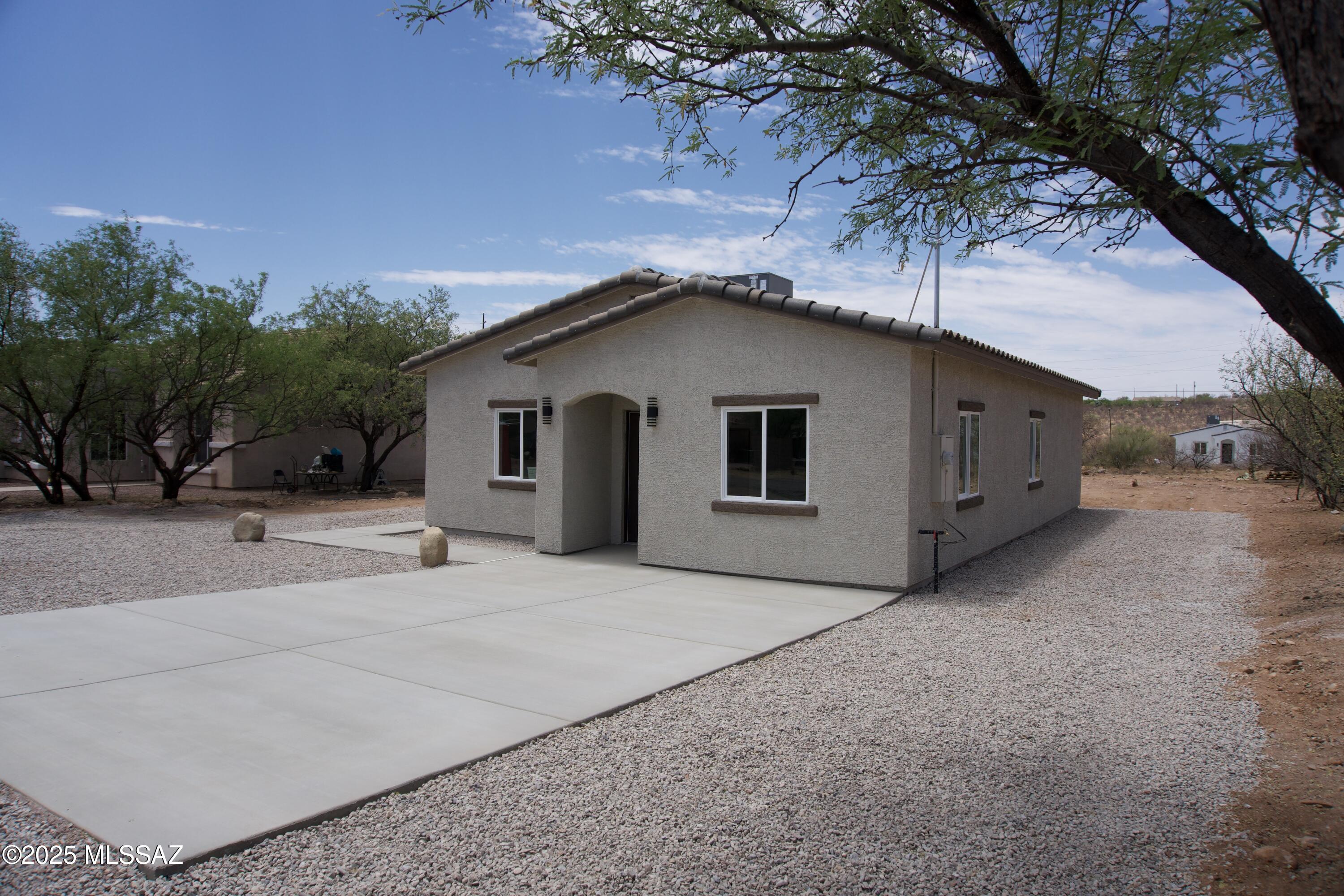 126 Alemania Court Rio Rico, AZ 85648 - Photo 3 of 31 a house with a outdoor space