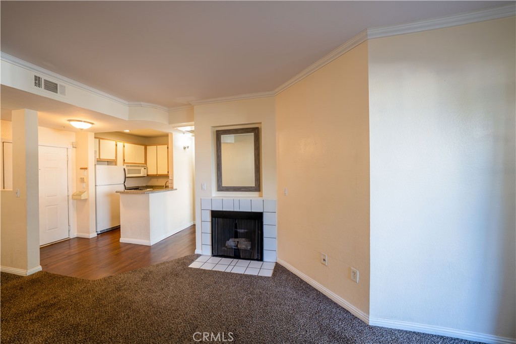 640 West 4th Street, Unit 101 Long Beach, CA 90802 - Photo 11 of 25 a living room with furniture and a fireplace