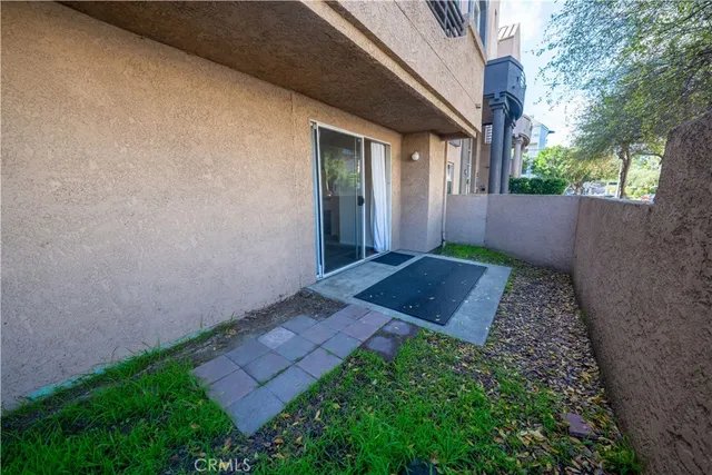 a view of a swimming pool with chair and table