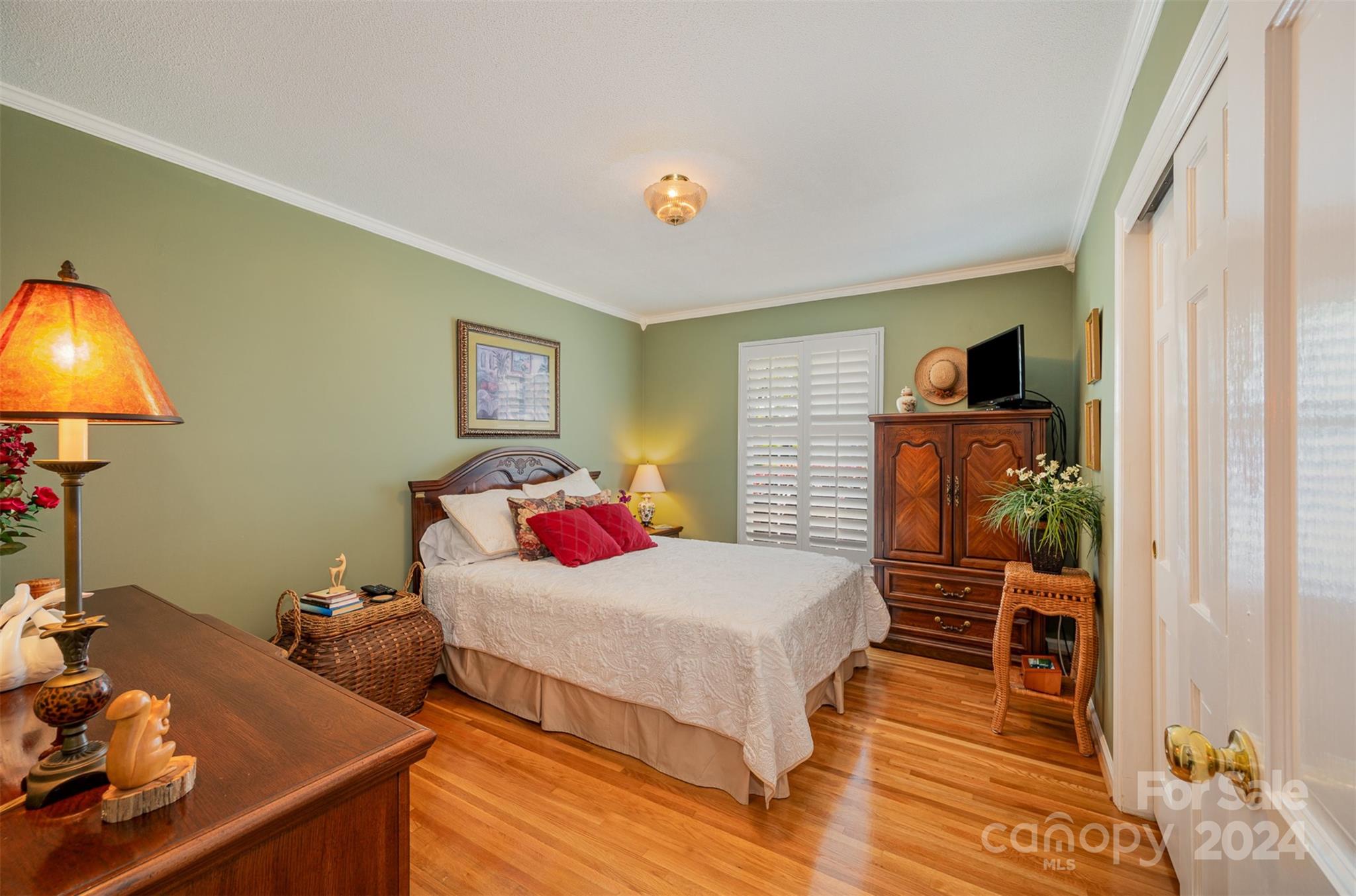 3409 Oak Tree Trail Matthews, NC 28105 - Photo 13 of 26 a bedroom with a bed and wooden floor