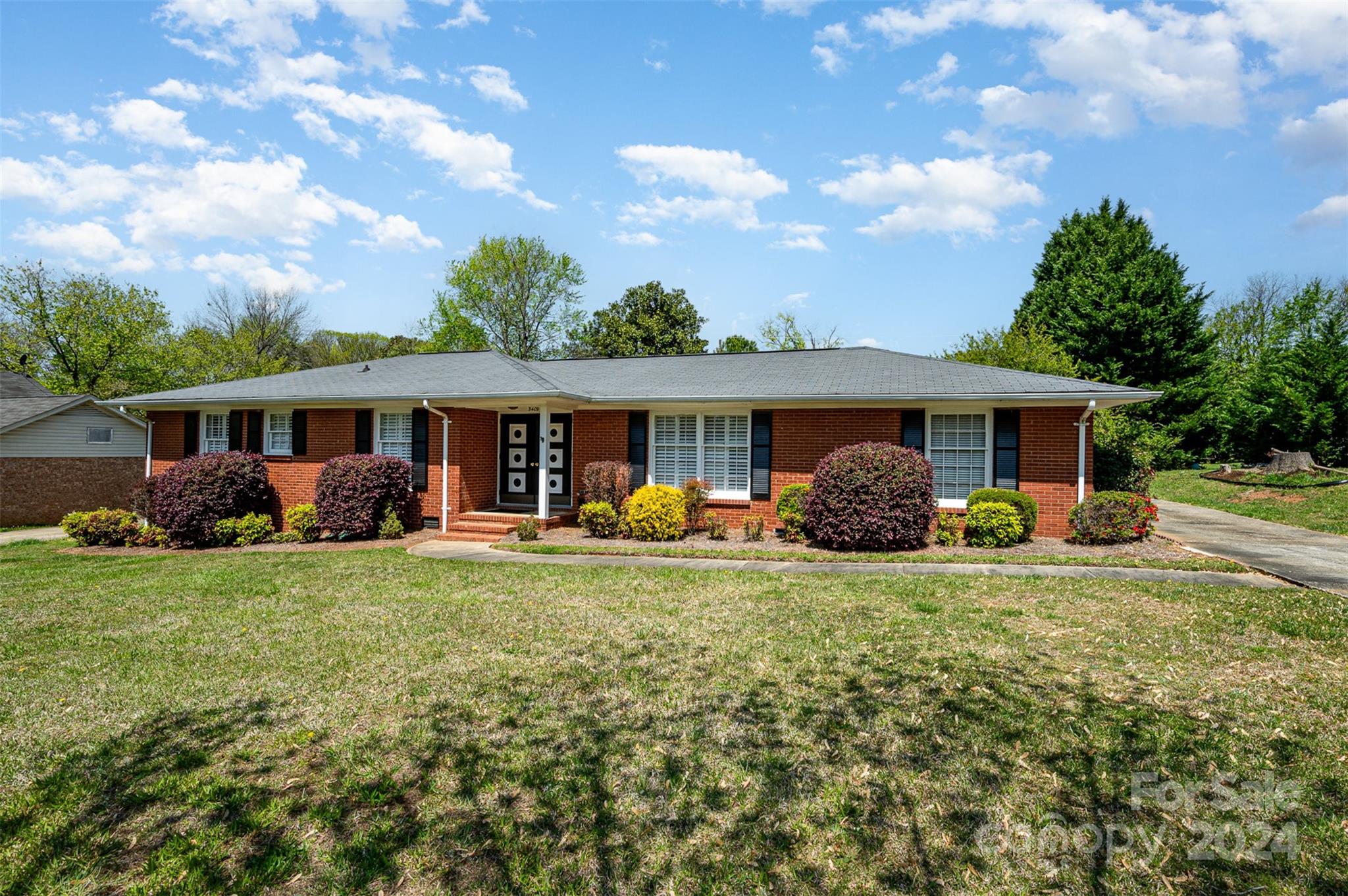 3409 Oak Tree Trail Matthews, NC 28105 - Photo 3 of 26 front view of a house with a yard