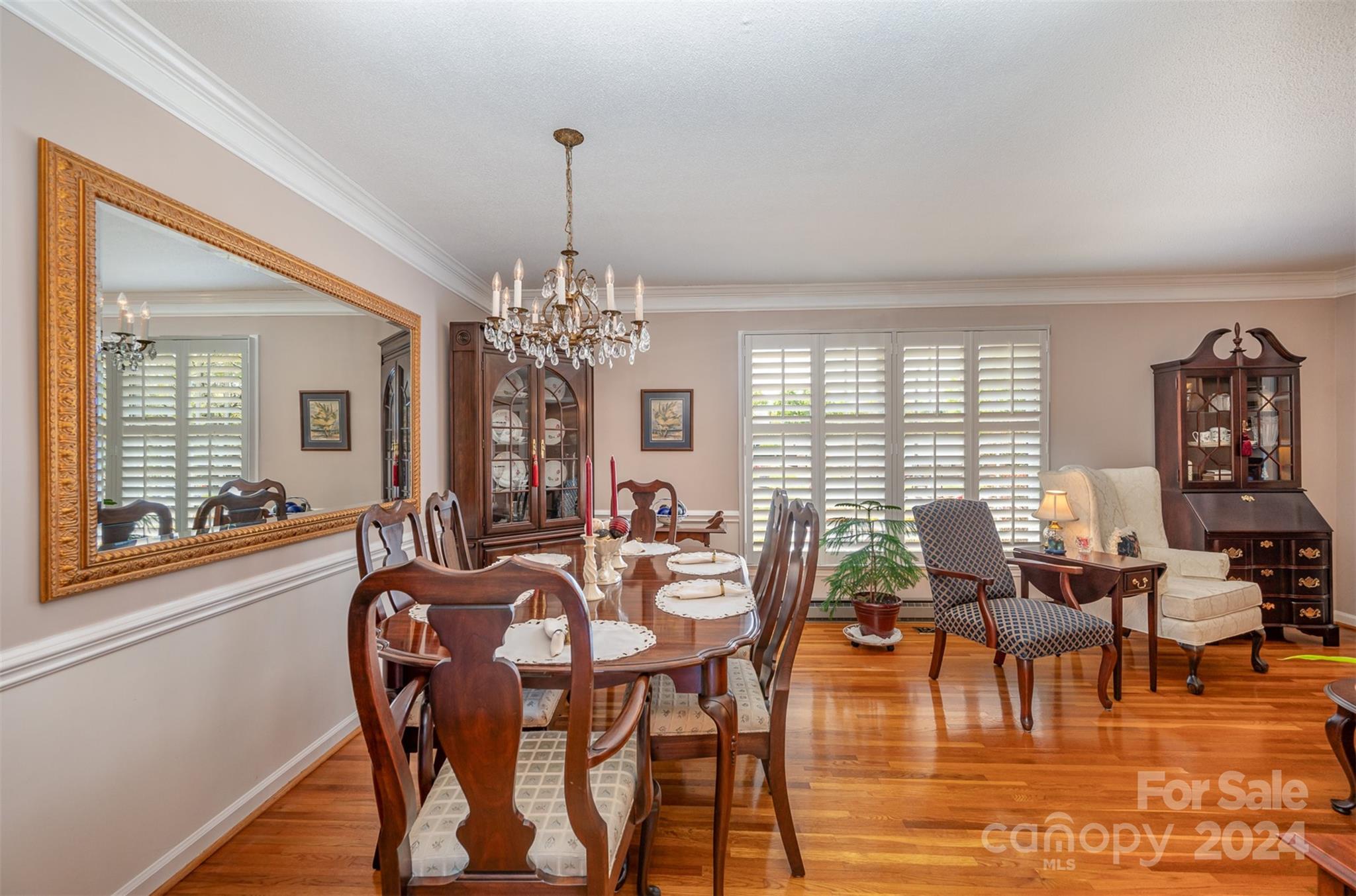 3409 Oak Tree Trail Matthews, NC 28105 - Photo 7 of 26 a view of a dining room with furniture window and wooden floor