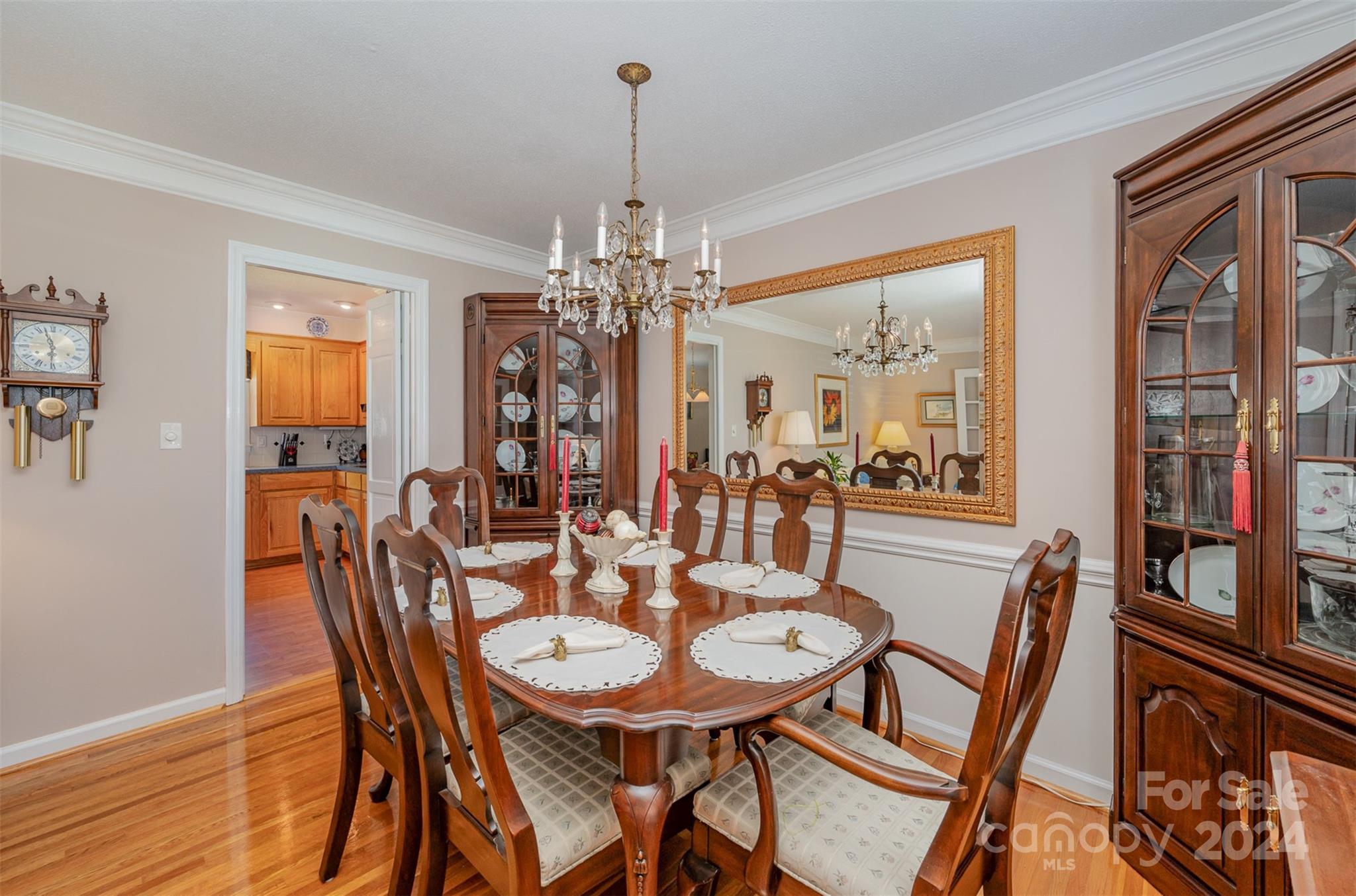 3409 Oak Tree Trail Matthews, NC 28105 - Photo 8 of 26 a view of a dining room with furniture window and wooden floor