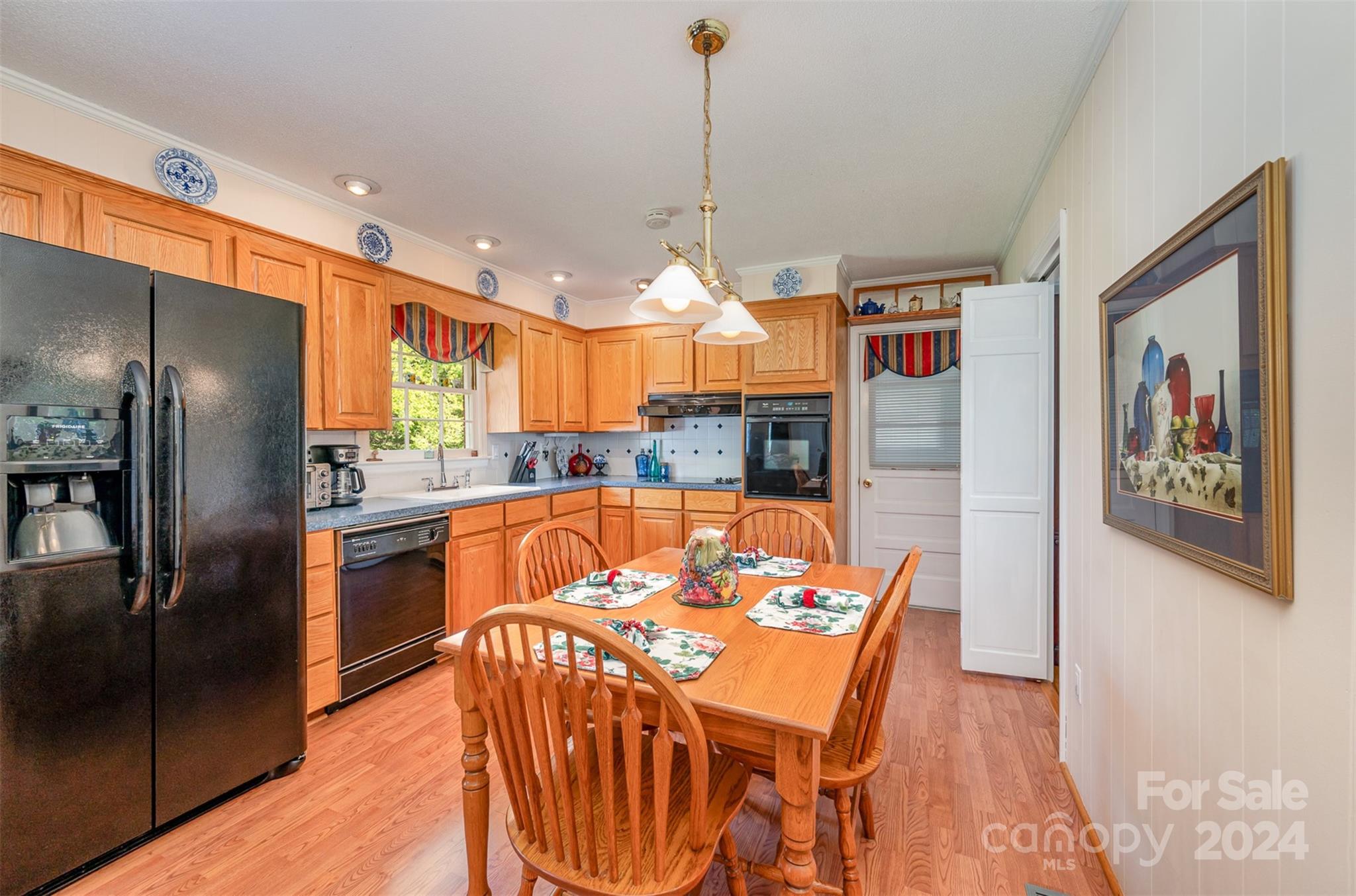 3409 Oak Tree Trail Matthews, NC 28105 - Photo 10 of 26 a kitchen with stainless steel appliances granite countertop a refrigerator a sink a stove and island