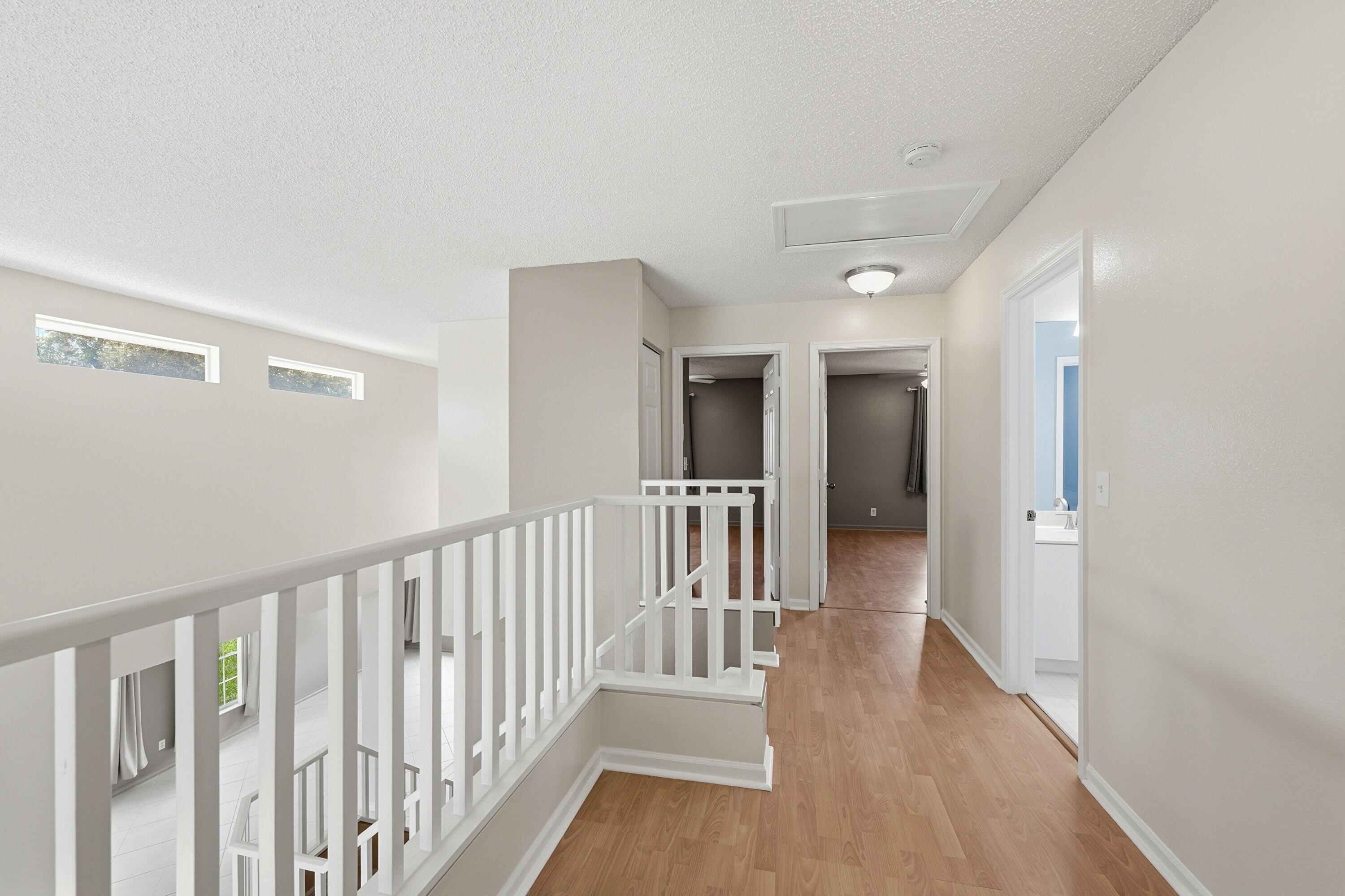 18474 Old Princeton Lane Boca Raton, FL 33498 - Photo 28 of 46 a view of a hallway with wooden floor and windows