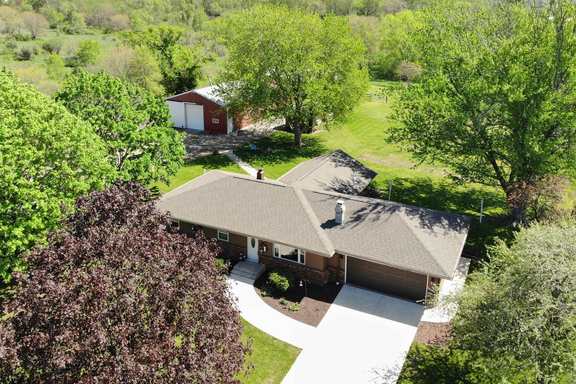 10030 Cemetery Road Pecatonica, IL 61063 - Photo 1 of 39 an aerial view of a house with yard and outdoor seating