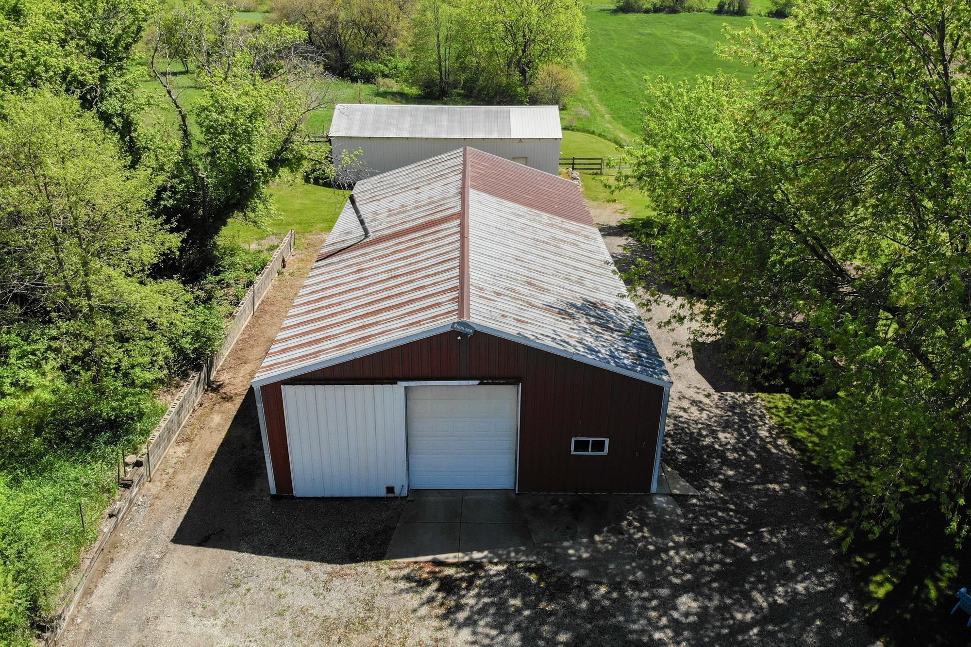 10030 Cemetery Road Pecatonica, IL 61063 - Photo 29 of 39 a view of a house with a yard