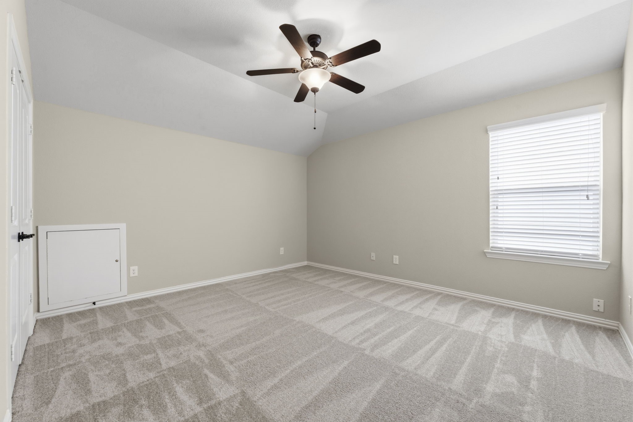 25210 Gaddis Oaks Drive Spring, TX 77389 - Photo 37 of 50 an empty room with ceiling fan and windows
