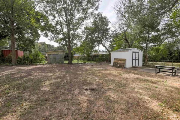 a house view with a backyard space