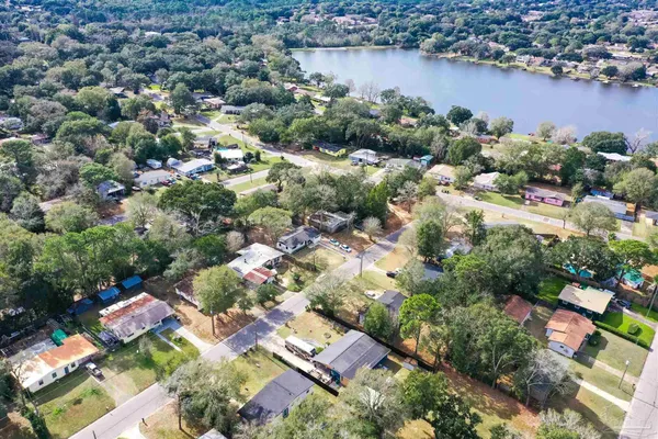 an aerial view of residential house with outdoor space and lake view