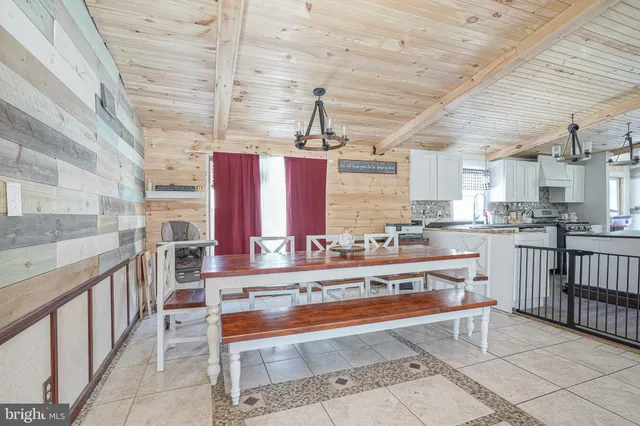 a large kitchen with kitchen island a stove a sink and dishwasher