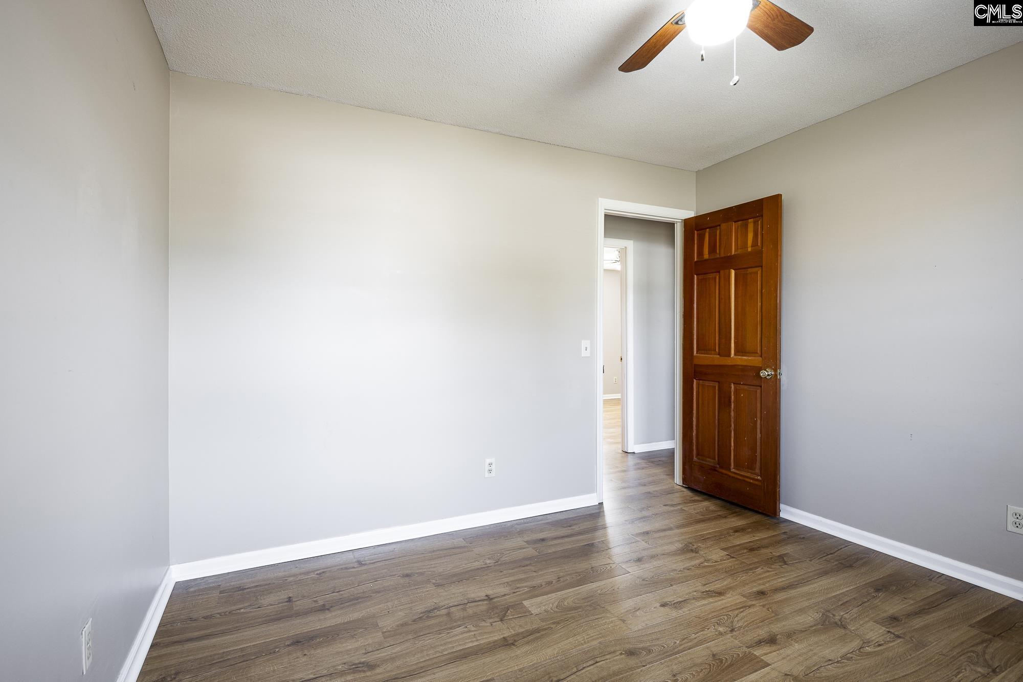 4083 Platt Springs Road West Columbia, SC 29170 - Photo 18 of 35 an empty room with wooden floor and windows