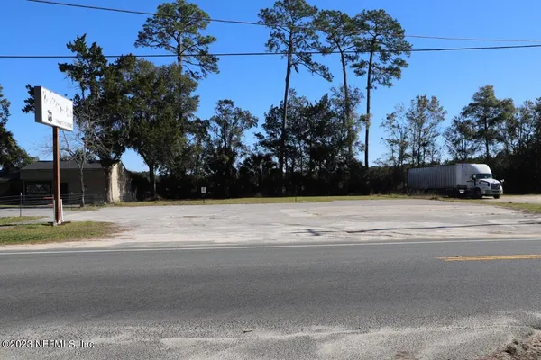 a street view of a house and street