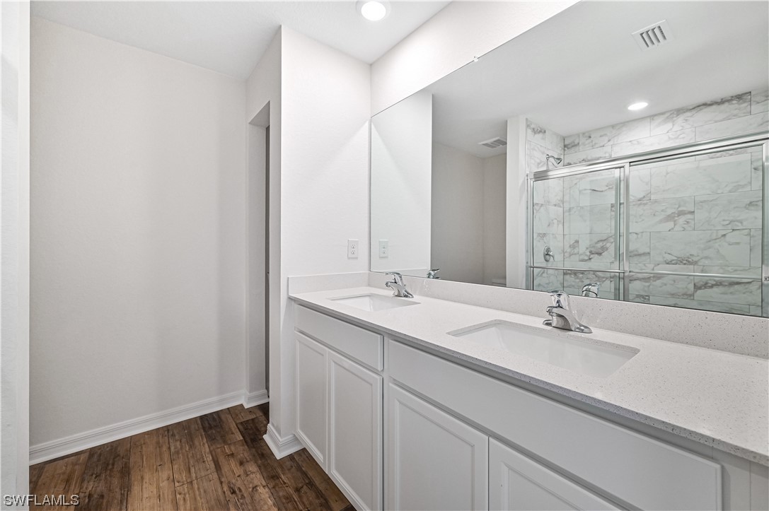 1344 Lincoln Court Immokalee, FL 34142 - Photo 12 of 21 a bathroom with a sink and a mirror