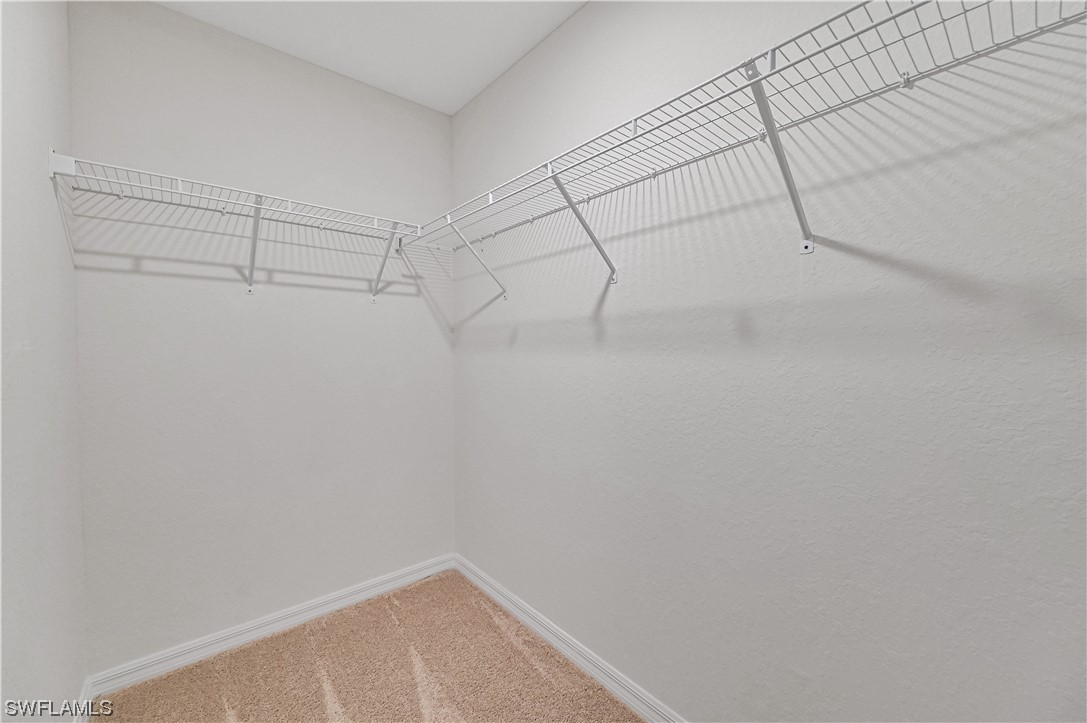 1344 Lincoln Court Immokalee, FL 34142 - Photo 14 of 21 a view of a room with racks on the wall