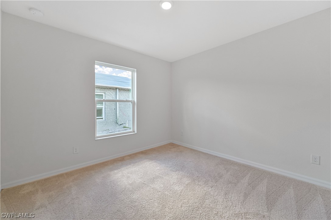 1344 Lincoln Court Immokalee, FL 34142 - Photo 15 of 21 an empty room with a window