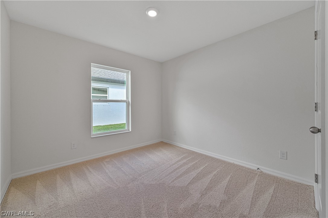 1344 Lincoln Court Immokalee, FL 34142 - Photo 16 of 21 an empty room with a window