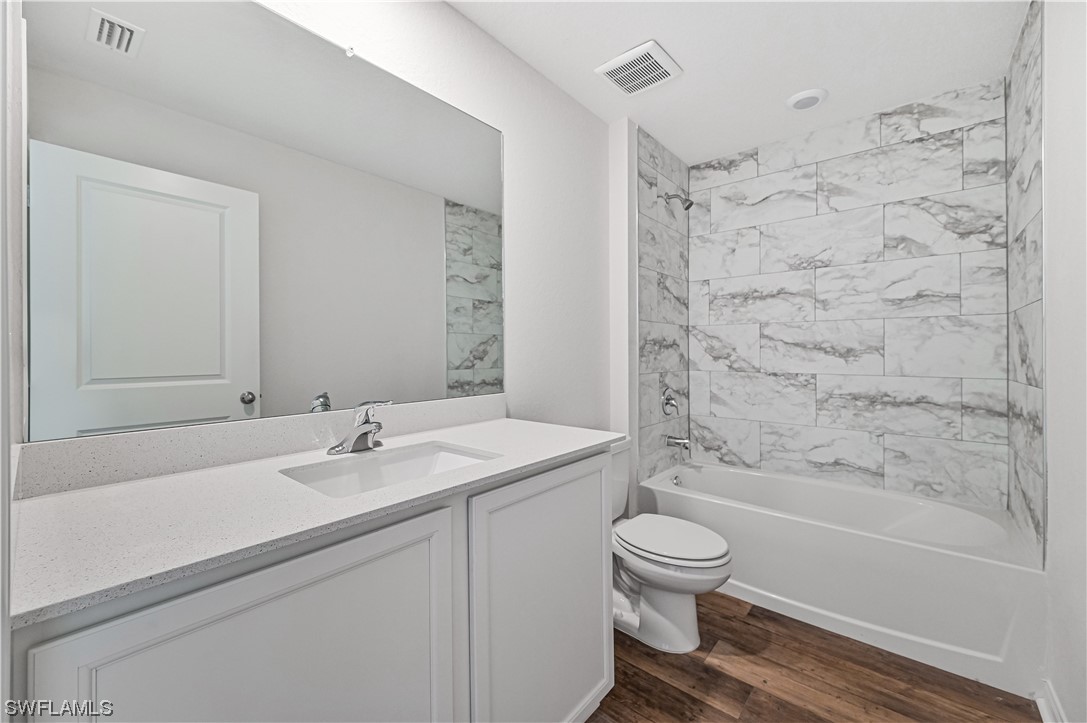 1344 Lincoln Court Immokalee, FL 34142 - Photo 17 of 21 a bathroom with a sink toilet and shower