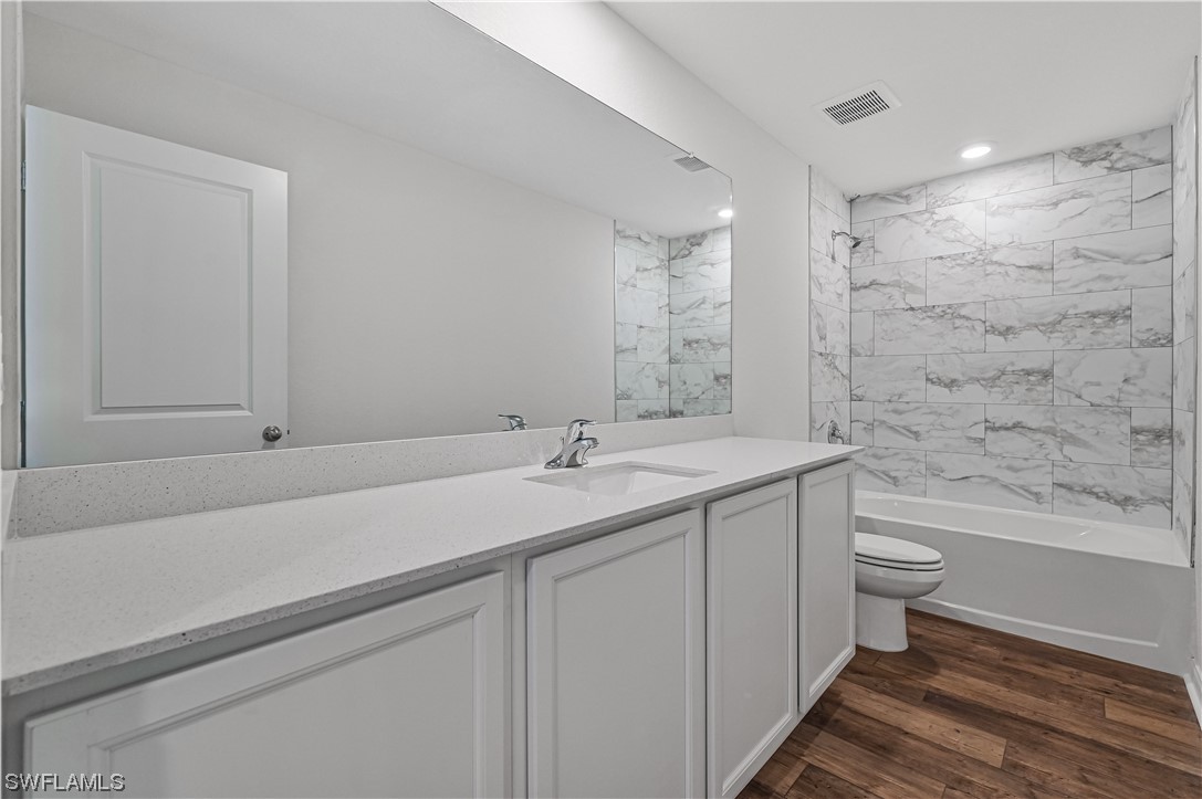 1344 Lincoln Court Immokalee, FL 34142 - Photo 20 of 21 a bathroom with a sink a toilet and shower