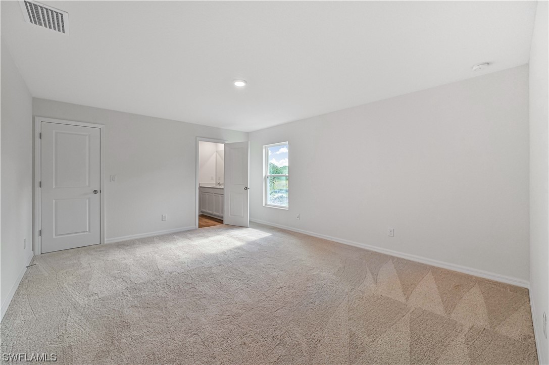 1344 Lincoln Court Immokalee, FL 34142 - Photo 10 of 21 a view of an empty room with window and closet area