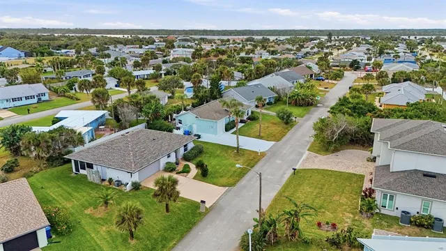 an aerial view of a house with a garden