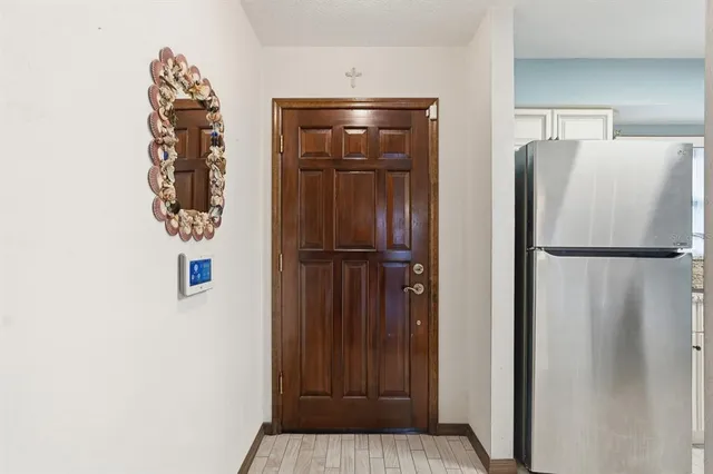 a view of kitchen with cabinets and stainless steel appliances