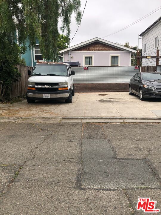 a car parked in front of a house