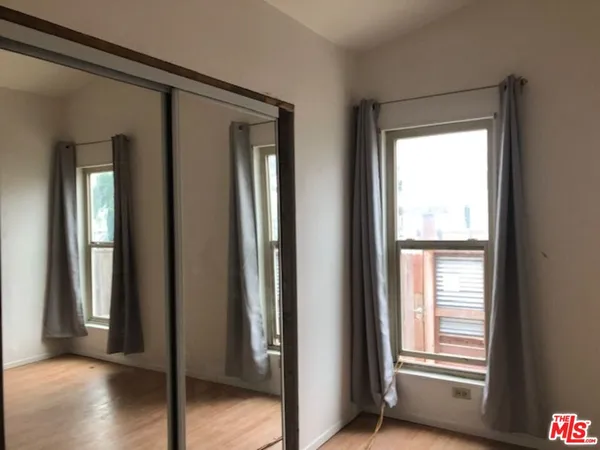 a view of an empty room and a window