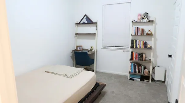 a bedroom with a bed and a cabinets