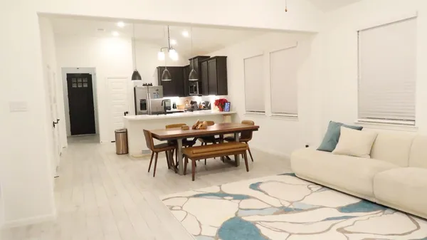 a living room with furniture and white walls