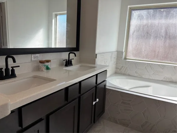 a bathroom with a sink and a bathtub