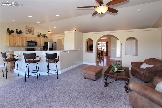 12010 Rio Secco Road Peyton, CO 80831 - Photo 35 of 36 Light, bright, open floor plan is perfect for entertaining