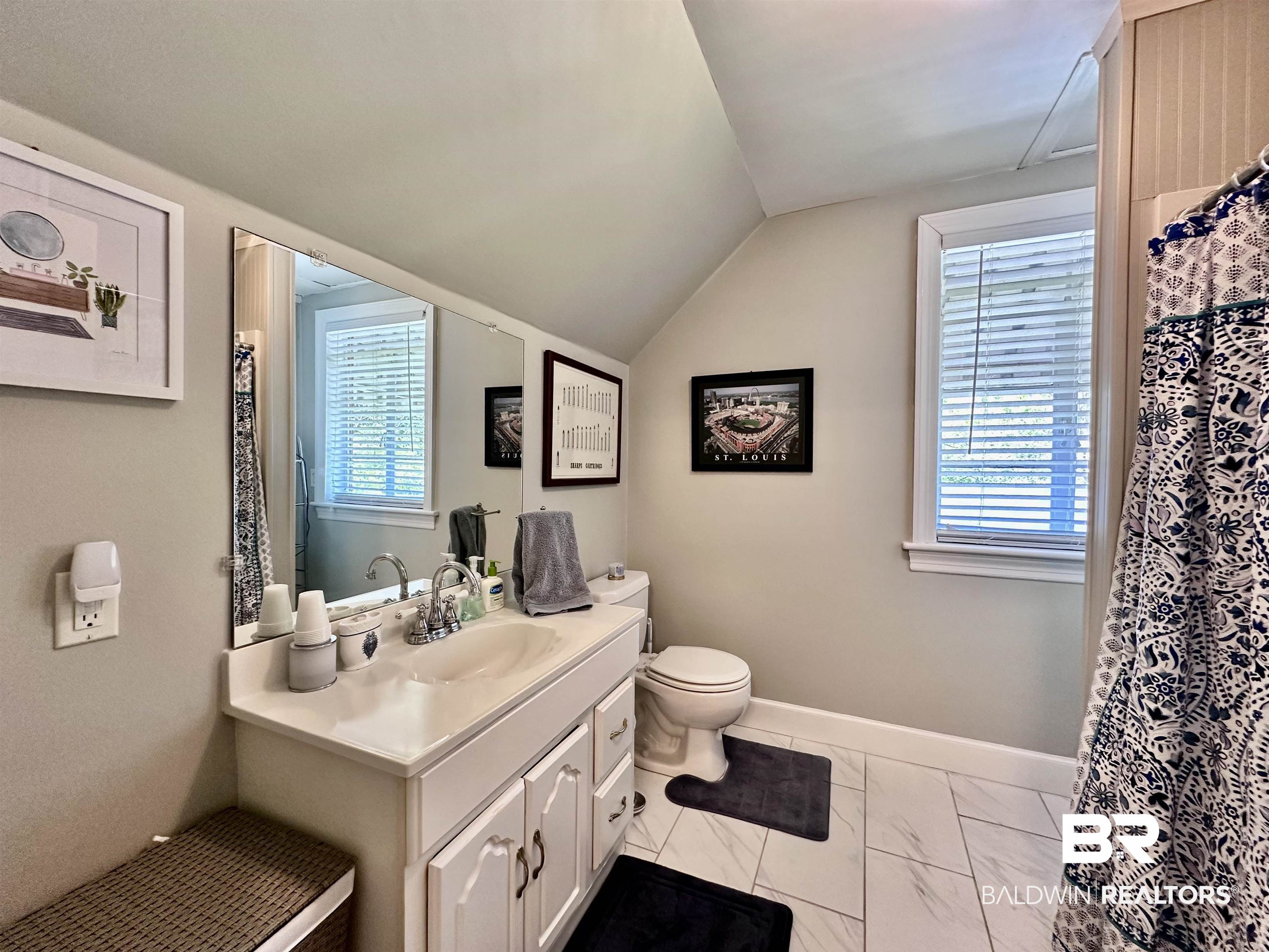 260 Siena Vista Street Mobile, AL 36607 - Photo 32 of 41 Full bathroom featuring vanity, toilet, vaulted ceiling, marble finish floors, and baseboards