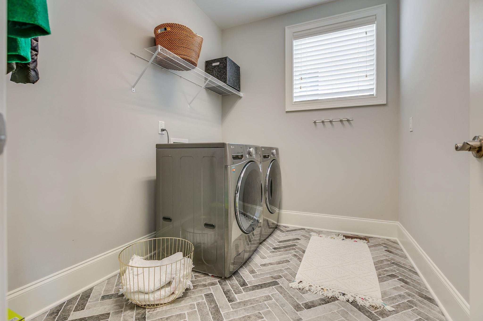 537 Alfred Ladd Road East Franklin, TN 37064 - Photo 19 of 28 Main floor laundry room with lots of space and tiled floor.