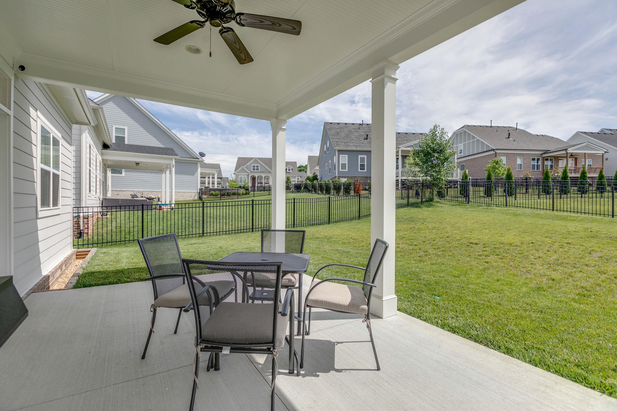 537 Alfred Ladd Road East Franklin, TN 37064 - Photo 25 of 28 Large covered patio with lighting and ceiling fan.
