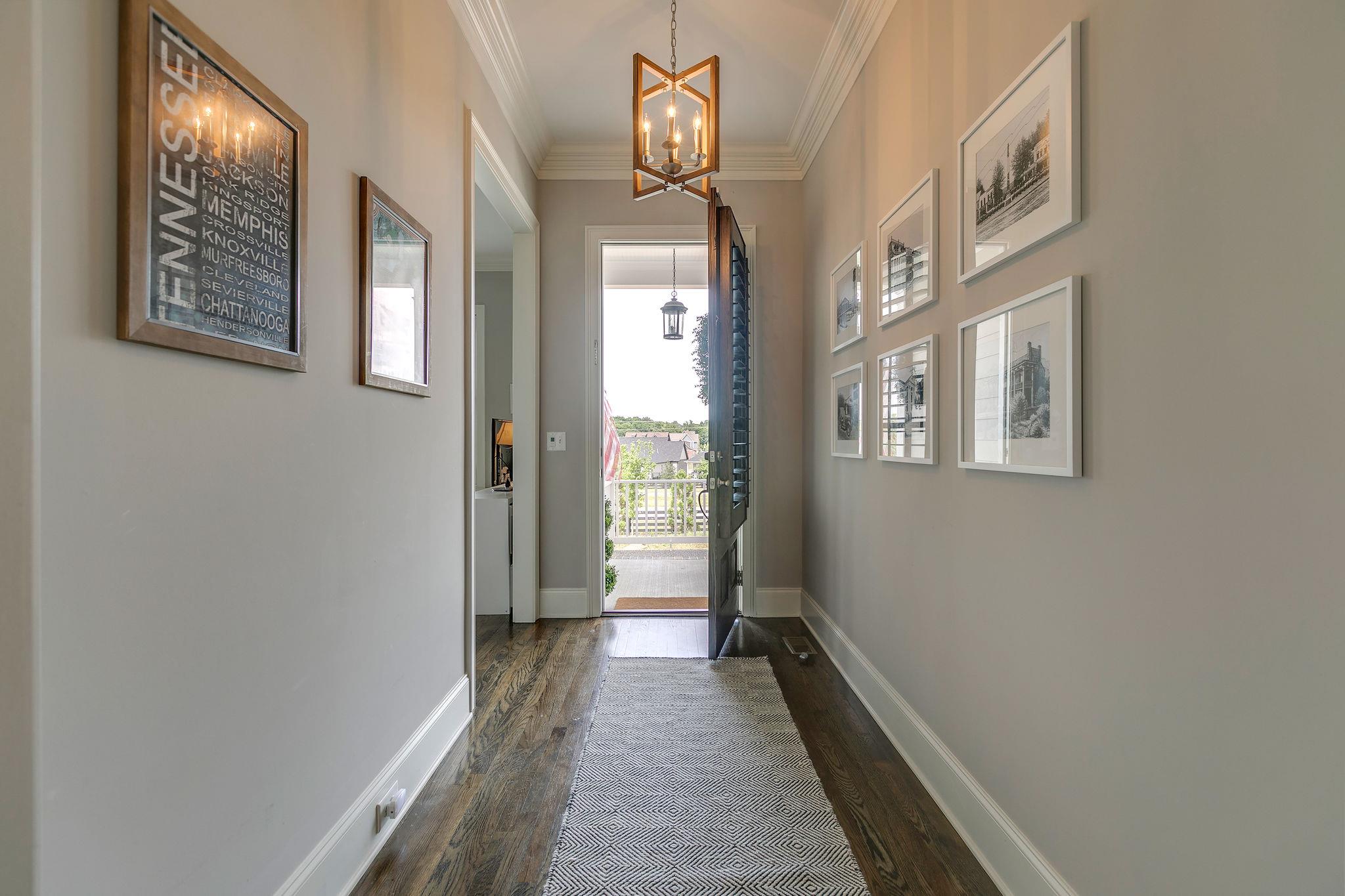537 Alfred Ladd Road East Franklin, TN 37064 - Photo 3 of 28 Beautiful light-filled entry with 10 ft ceilings, crown molding, and sand and finish hardwood floors.