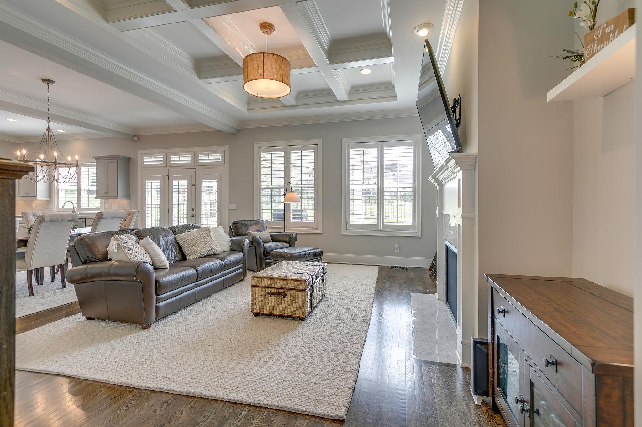 537 Alfred Ladd Road East Franklin, TN 37064 - Photo 4 of 28 Family room with coffered ceiling and wall of windows.