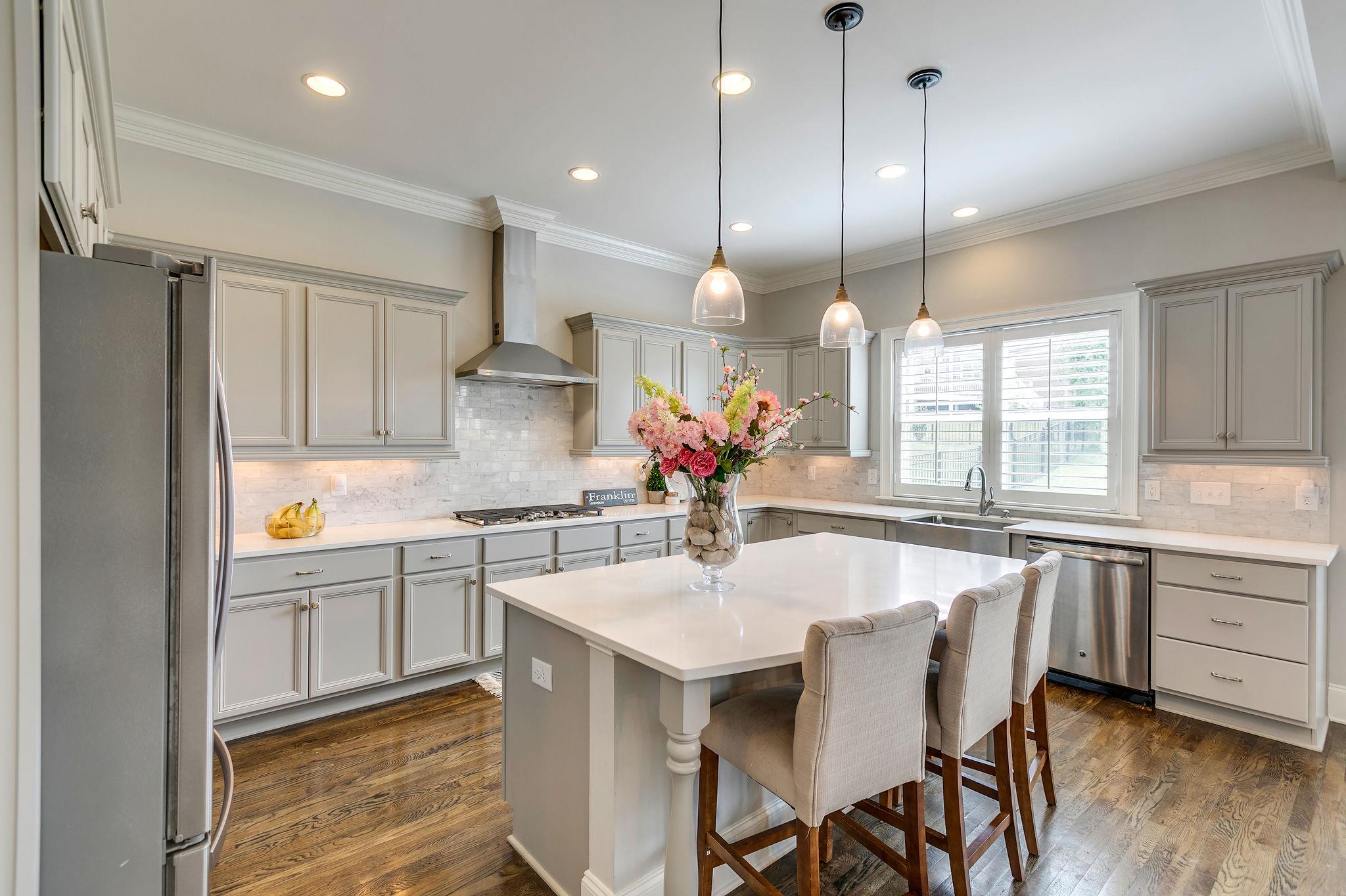 537 Alfred Ladd Road East Franklin, TN 37064 - Photo 9 of 28 5 burner gas cooktop and apron front stainless steel sink.