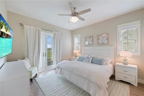 a bedroom with a bed and a night stand