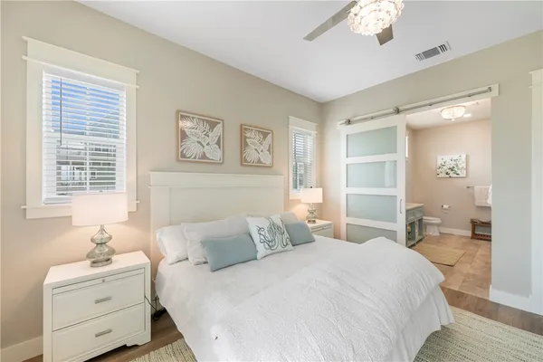 a spacious bathroom with a double vanity sink and a mirror