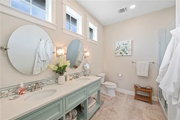 a bathroom with a shower and a sink