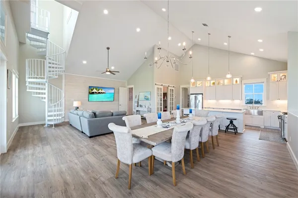a kitchen with stainless steel appliances a sink dishwasher stove microwave and cabinets