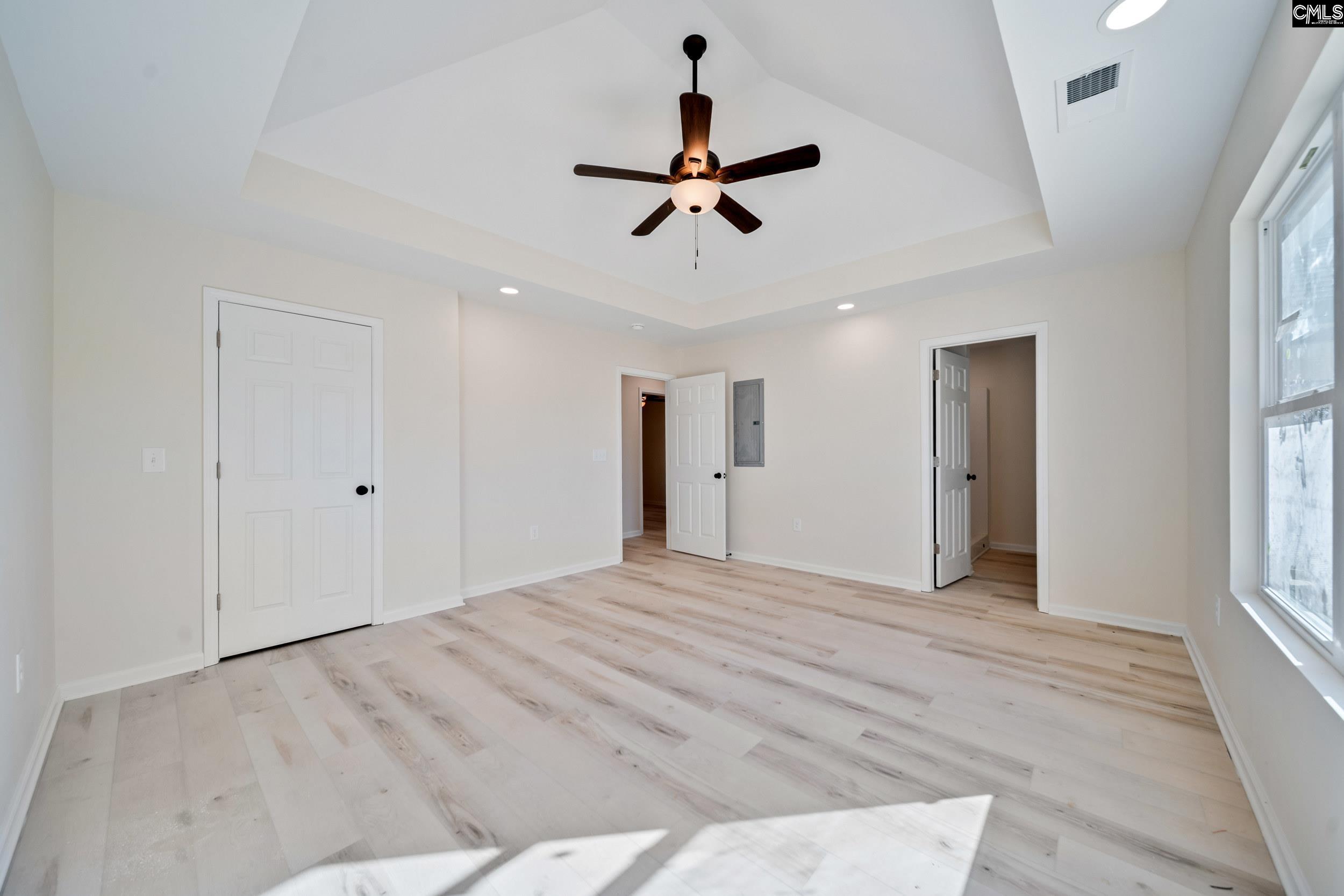 116 Sunny Acres Road Eastover, SC 29044 - Photo 21 of 40 a view of empty room with wooden floor and ceiling fan