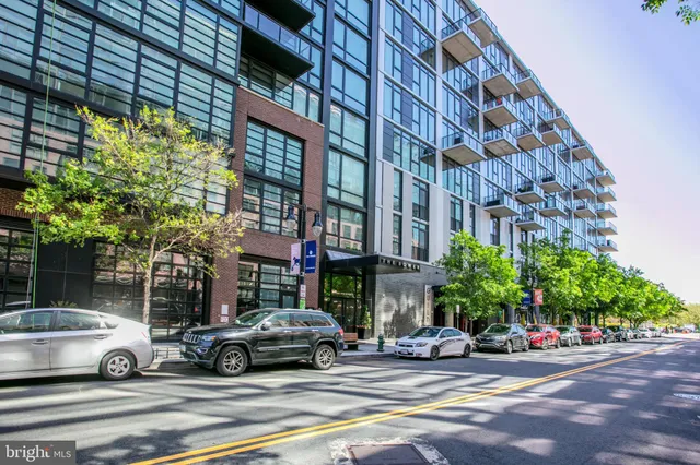 a kitchen with refrigerator cabinets and wooden floor