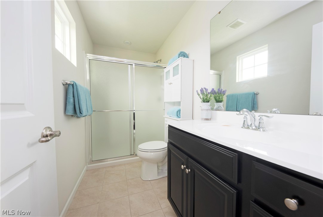 238 Stone Ridge Way Berea, OH 44017 - Photo 21 of 30 Master bath also smartly appointed with upgraded fixtures, cabinets, and ceramic tile flooring.