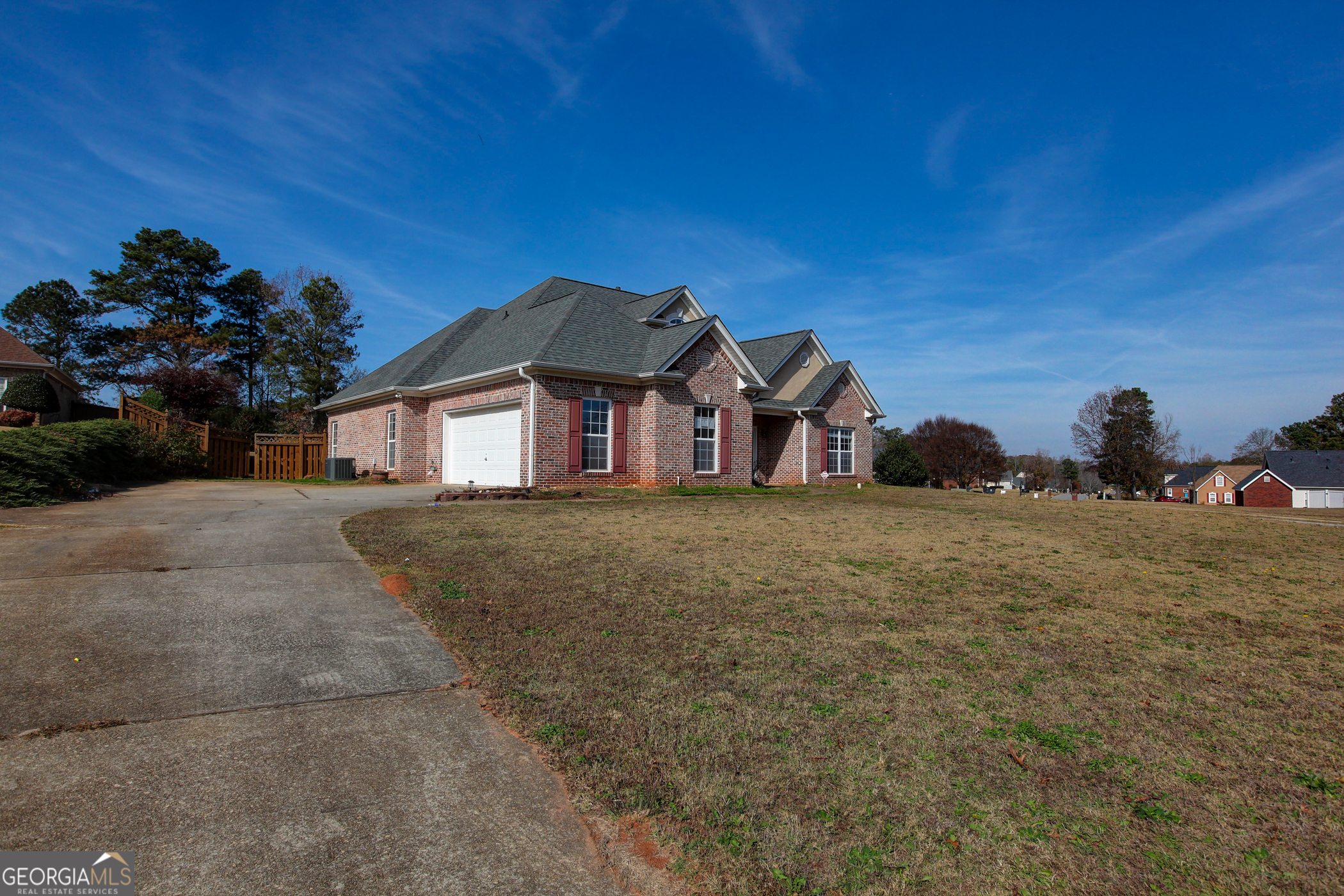 a view of a large house with a yard