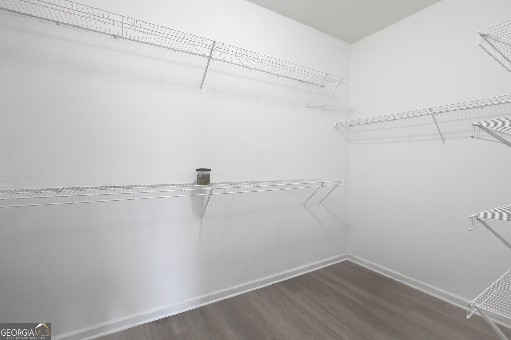 500 Soho Place Locust Grove, GA 30248 - Photo 12 of 26 a view of a room with racks on the wall