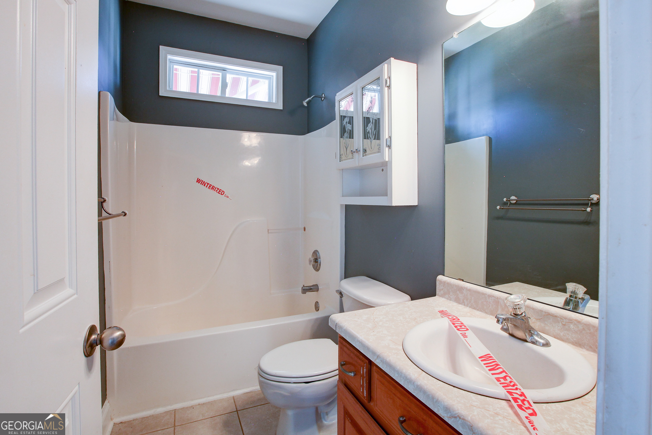 500 Soho Place Locust Grove, GA 30248 - Photo 23 of 26 a bathroom with a sink toilet and shower